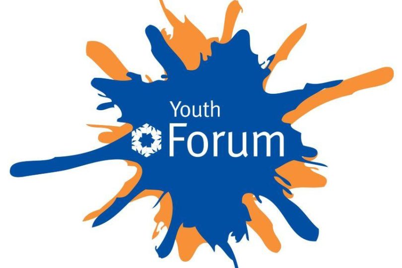 Youth Forum logo featuring a blue and orange paint splatter with the words “Youth Forum” in white, incorporating the Millennium Forum’s signature cogwheel motif.